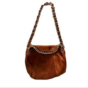 Antonio Melani leather shoulder bag with gold metal details.